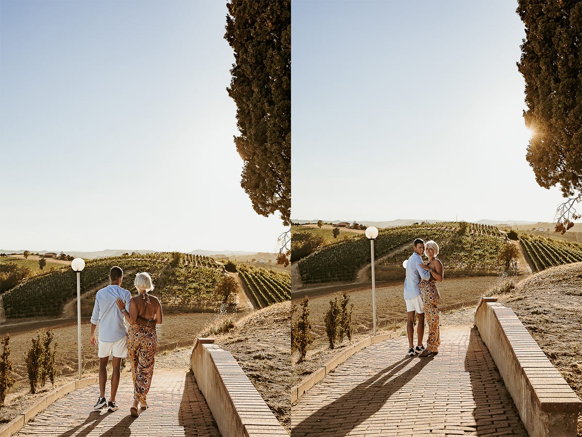 Prewedding da sogno a Nizza Monferrato intorno alla chiesa della Madonna della Neve. Matteo e Fiammetta camminano lungo il vialetto verso i vigneti.