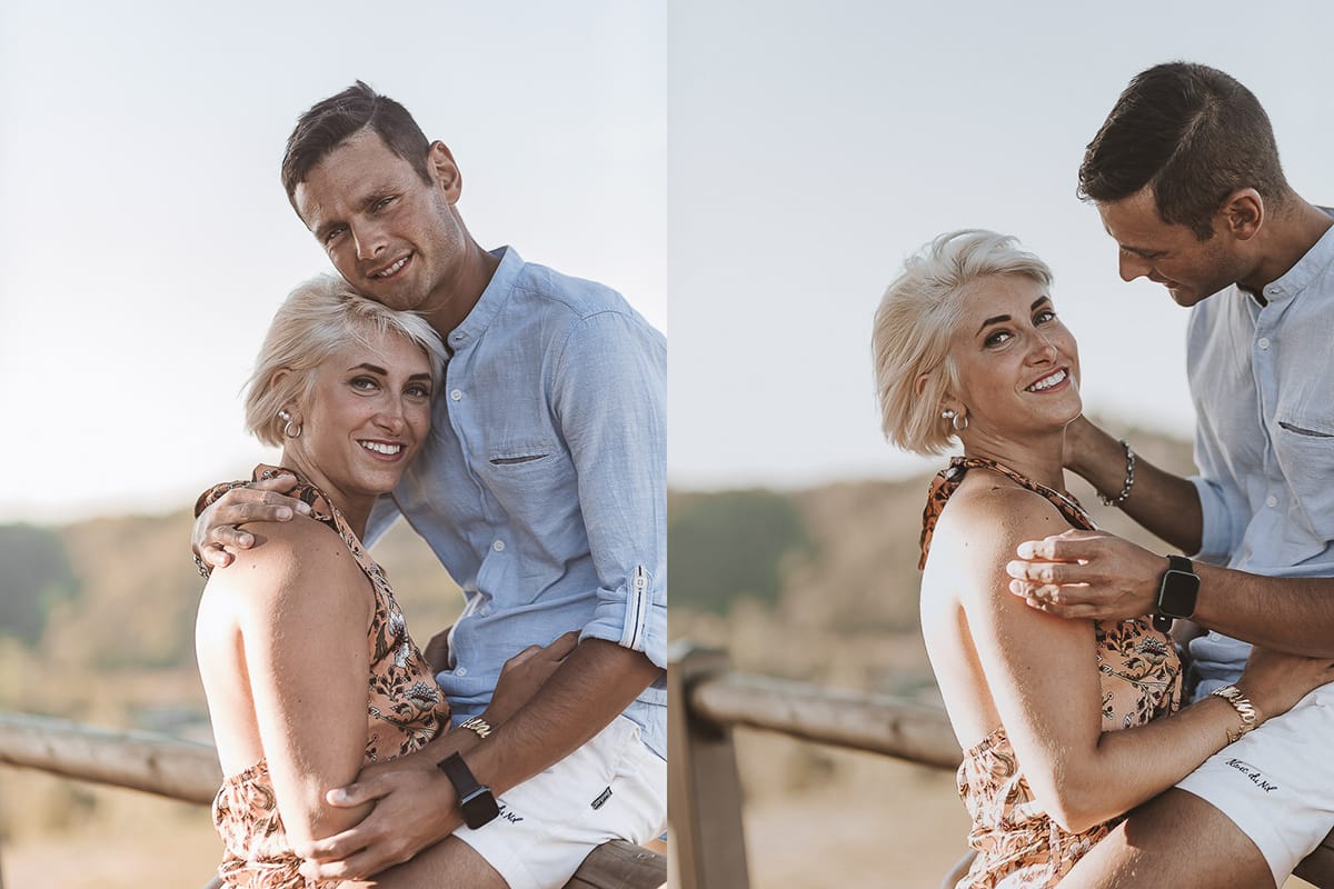Prewedding da sogno a Nizza Monferrato intorno alla chiesa della Madonna della Neve. Matteo seduto su di una staccionata di legno abbraccia Fiammetta.