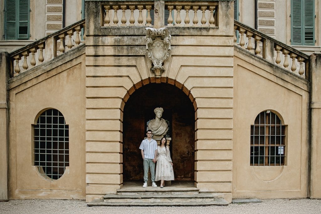 Pre-wedding at Castello di Santena. Fabiola and Cristian under the castle's staircase, in a niche near a statue. 