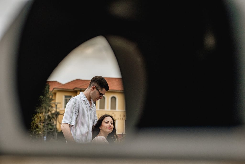A unique perspective: Fabiola and Cristian's pre-wedding at Castello di Santena, photographed through a trash can, demonstrating that creativity can be found anywhere. 