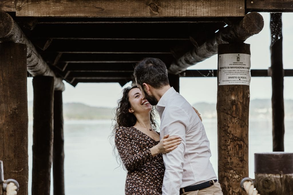 A romantic moment during Ilaria and Luca's pre-wedding shoot at Lake Viverone. A kiss. 