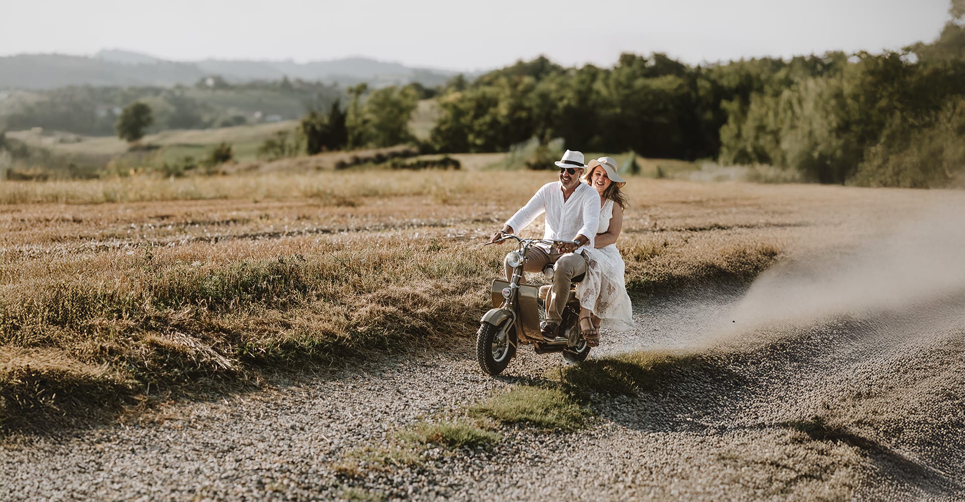a man and woman riding a motorcycle